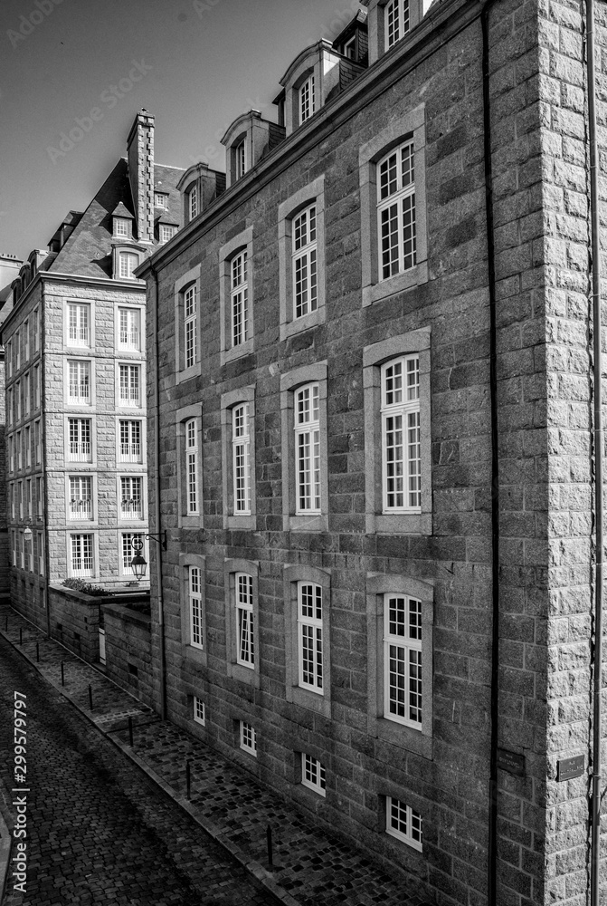 black and white view of historic Norman stone houses in the Saint-Malo Intra-Muros Neighboorhood