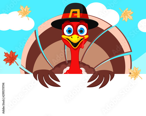 Turkey in a hat looks out from behind a white shield, a place for text. Thanksgiving day
