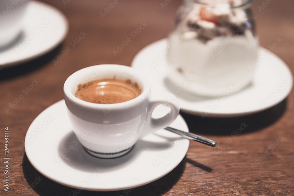 Fototapeta premium cup of espresso on a wooden table