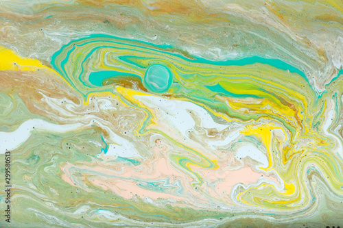 Yellow, green and gold agate ripplle pattern. Pale beautiful marble background. photo