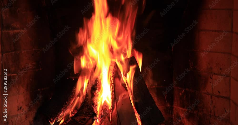 Burning and glowing pieces of wood in Fireplace Burning and glowing pieces of wood in Fireplace