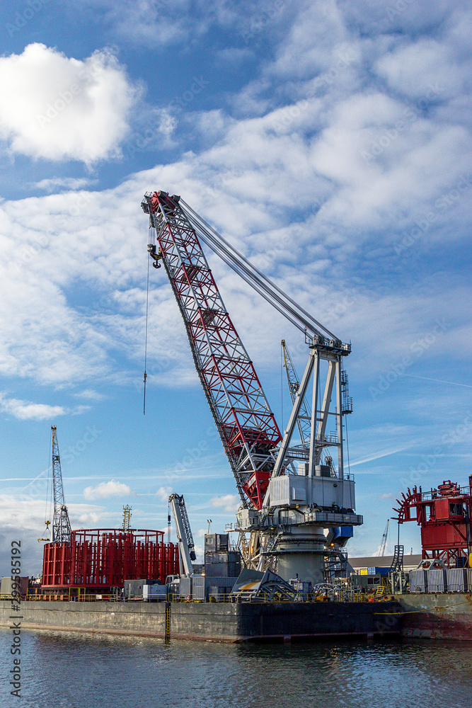 Crane to unload containers in the port of Rotterdam, the Netherlands, Europe.
