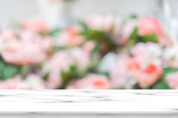 abstract blurred group of freshness blossom pink roses flowers background with luxury marble counter top perspective for summer and spring season to show and promote product on display image
