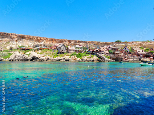 beautiful azure water and the coast at Anchor Bay in Malta.