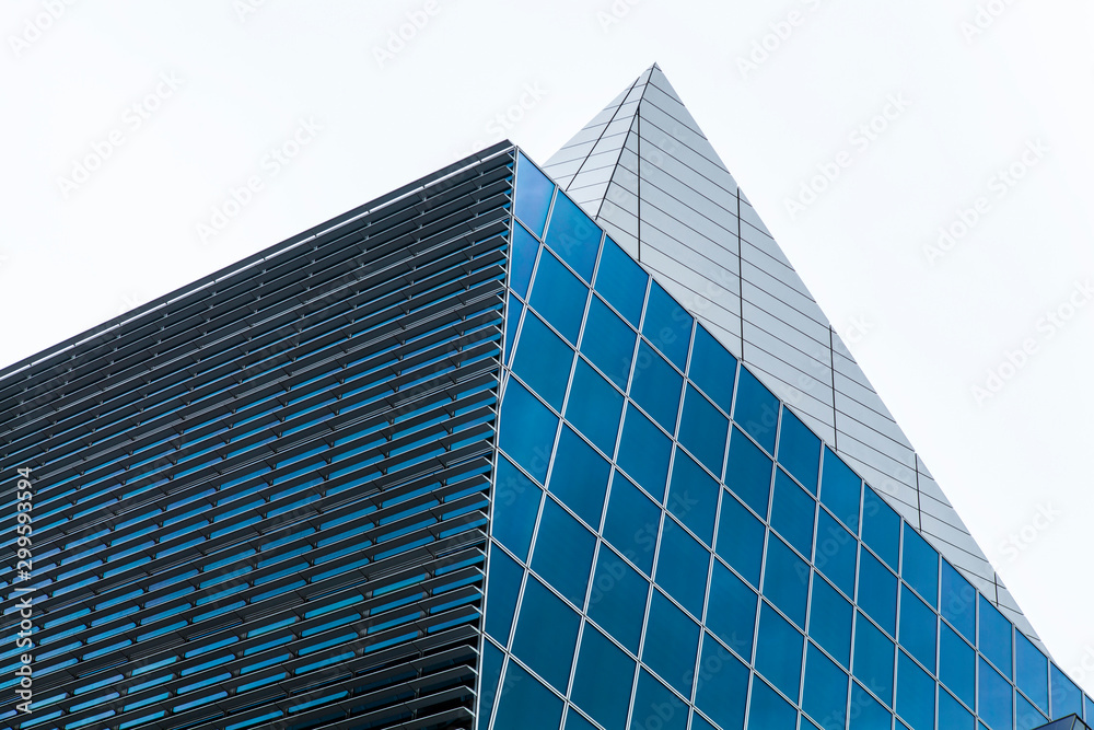 Urban Geometry, glass and steel building, close up of the top. Modern architecture. City design. Inspirational, artistic image. Urban Geometry, glass and steel building, close up of the top. Modern architecture. City design. Inspirational, artistic image.