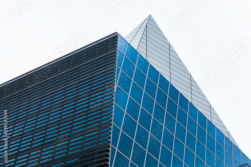 Urban Geometry, glass and steel building, close up of the top. Modern architecture. City design. Inspirational, artistic image.