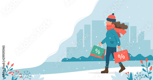 Woman with sales bags in winter. Cute vector illustration in flat style.