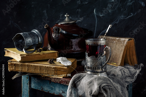Slika na platnu A glass of hot black tea in a vintage cup holder