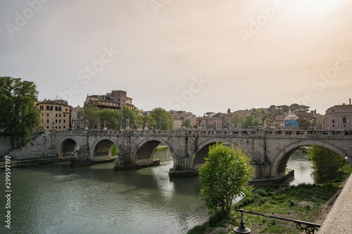 Bridge over the Tiber river in Rome at sunset