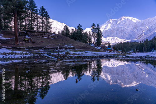 Water Reflection of Fairy meadows during the sunset period with  Nanga parbat mountain range , gilgit-baltistan , Pakistan photo