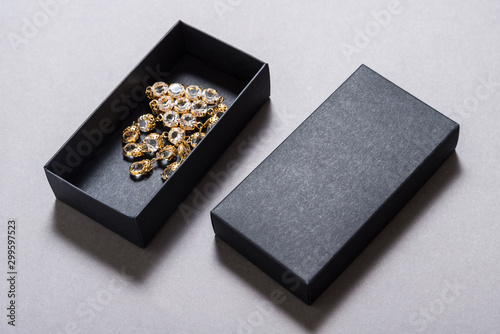 Fototapeta Naklejka Na Ścianę i Meble -  Black carton gift box with jewelry, mock up isolates