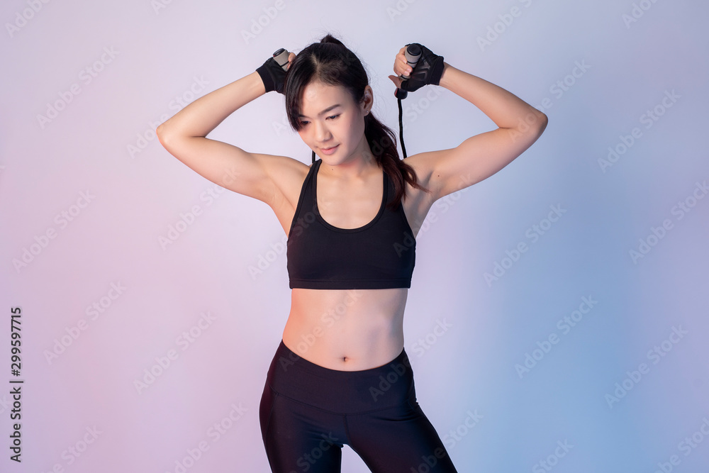 Beautiful asian fitnesses woman in studio
