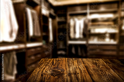 Nice interior of the wardrobe with wooden table top space for advertising products and decorations or text.