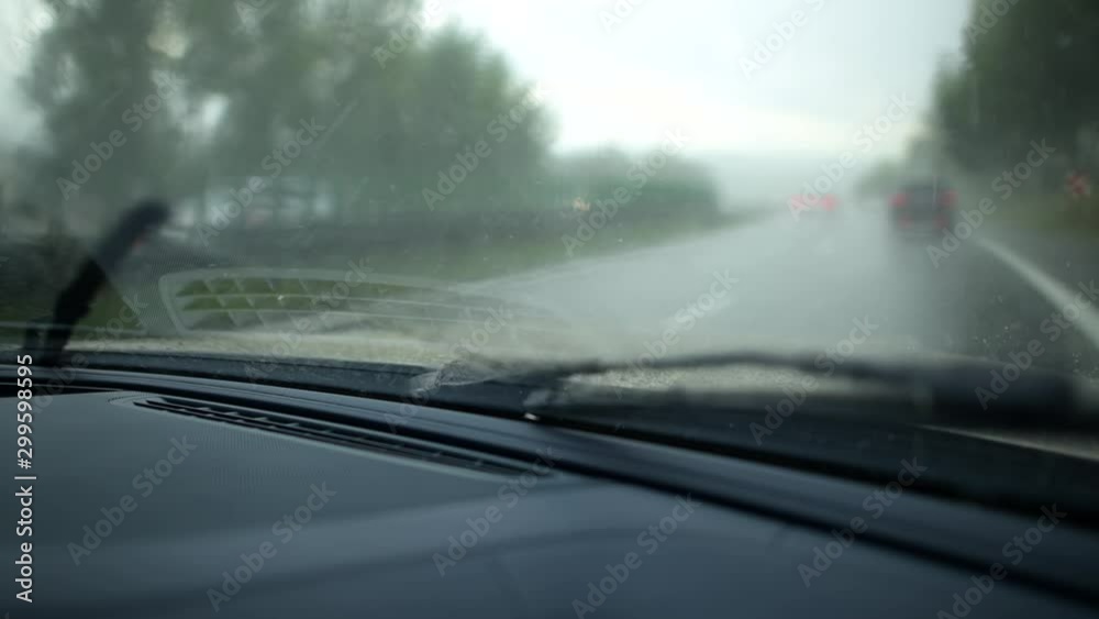 Running Windshield Wipers in Modern Car. Driving in Rain. Running Windshield Wipers in Modern Car. Driving in Rain.