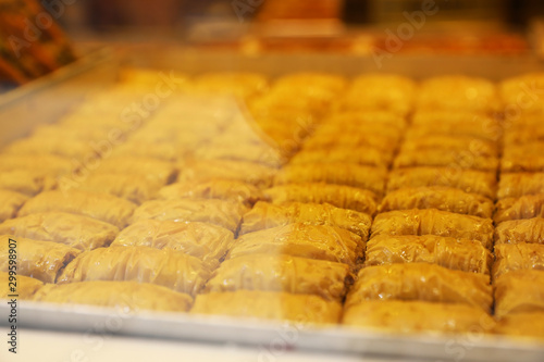 Closeup view of turkish pastries in shop through window glass