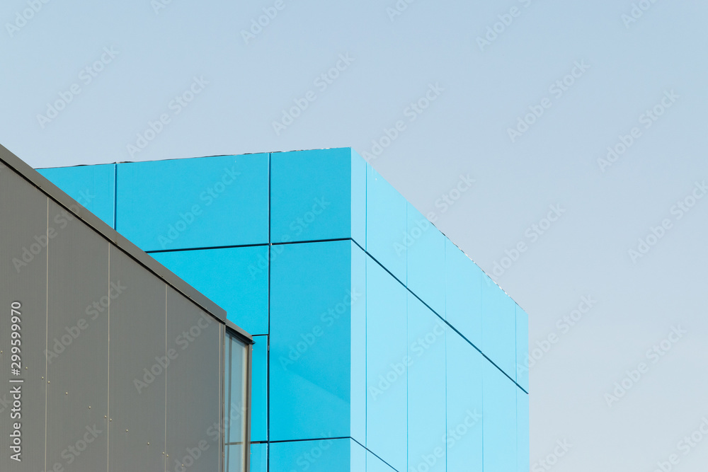 Geometric colored building facade elements with planes, lines and corners with light flare and reflections for an abstract background and texture of white, blue, gray colors. Place for text Geometric colored building facade elements with planes, lines and corners with light flare and reflections for an abstract background and texture of white, blue, gray colors. Place for text