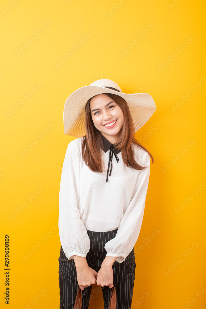 Beautiful traveler woman is exciting on yellow background Beautiful traveler woman is exciting on yellow background