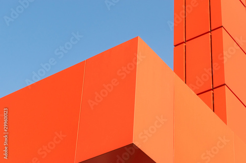 Geometric colored building facade elements with planes, lines and corners with light flare and reflections for an abstract background and texture of white, blue, gray colors. Place for text