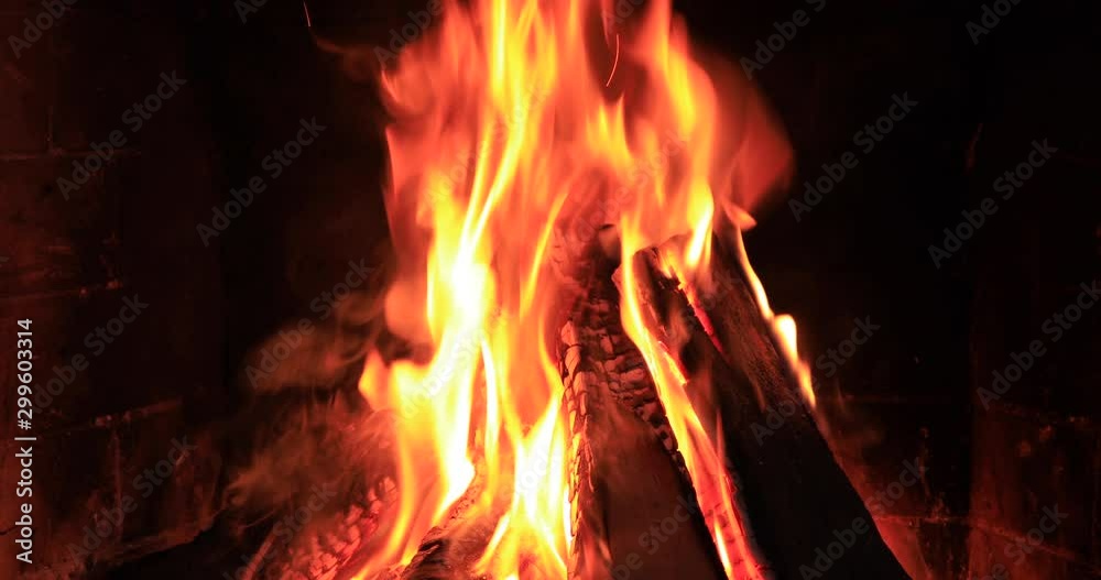 Burning and glowing pieces of wood in Fireplace Burning and glowing pieces of wood in Fireplace