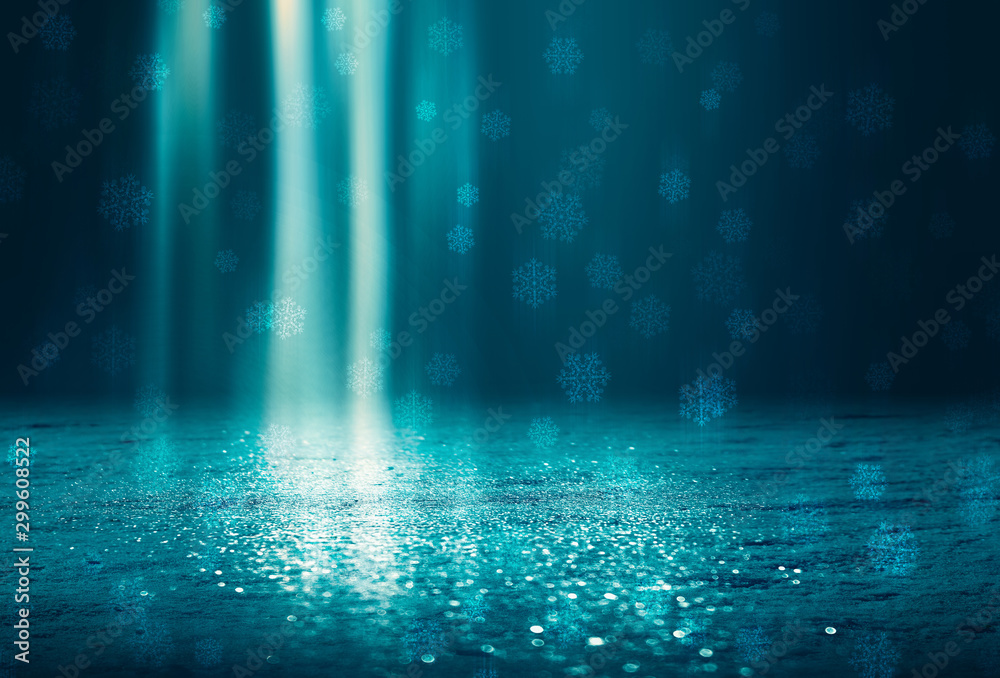 Fototapeta Winter abstract, blurred background with bokeh. Blurry night city lights in reflection on a snowy road. Neon light, falling snow, snowflakes.