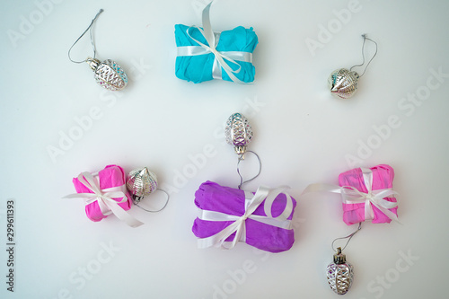 Gifts in packing on a white background. Holiday concept. Gentle colors