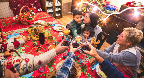 Canvas Print Happy multi generation family having fun at christmas supper party - New year's