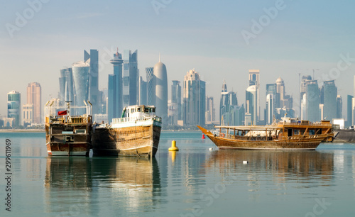 Old Wooden Boats and Dhows in Doha Bay and Skyline of West Bay in Distance (City Center / Downtown) - Doha, Qatar