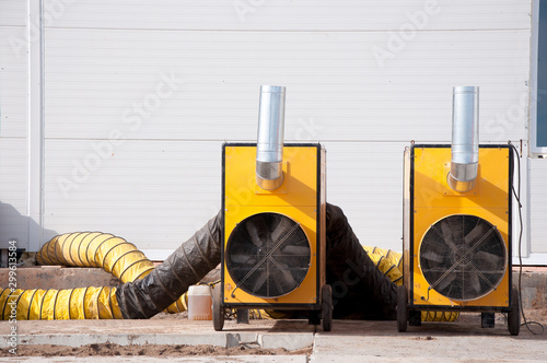 Large diesel heaters at a construction site. Equipment for heating a room in a cold period of time.