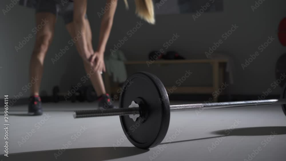 Female bodybuilder doing weightlifting exercises