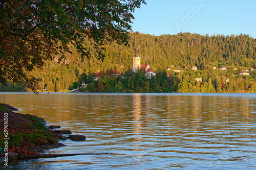 Early morning lights landscape of Lake Bled (Blejsko Jezero) with the Pilgrimage Church of the Assumption of Maria on small island. Popular travel destination in Slovenia