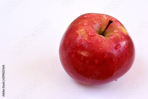 Dewy apple on a white background