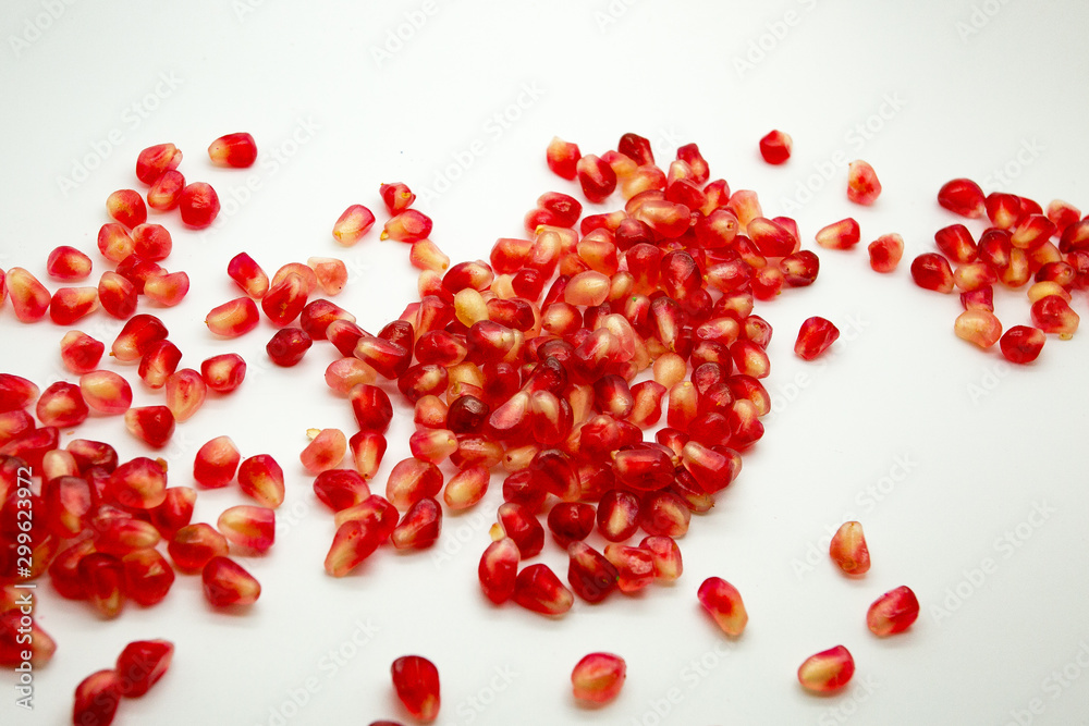 heart made of pomegranate seeds isolated on white heart made of pomegranate seeds isolated on white
