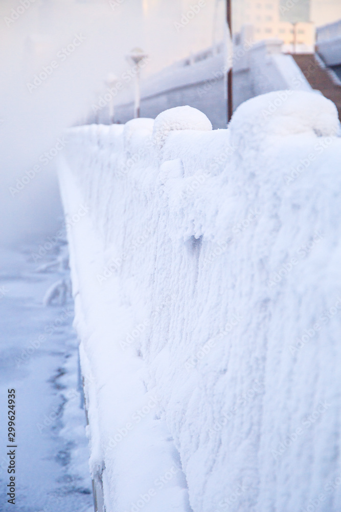 Winter landscape of frosty trees, white snow in city park. Trees covered with snow in Siberia, Irkutsk near lake Baikal. Extremely cold winter Winter landscape of frosty trees, white snow in city park. Trees covered with snow in Siberia, Irkutsk near lake Baikal. Extremely cold winter