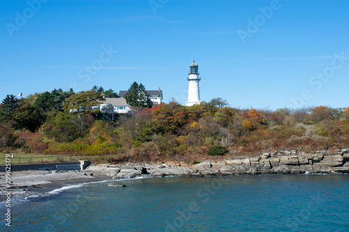 View of Cape Elizabeth Lighthouse from Dyer Point, Cape Elizabeth, Maine. This is a white light tower next to a white building building -04