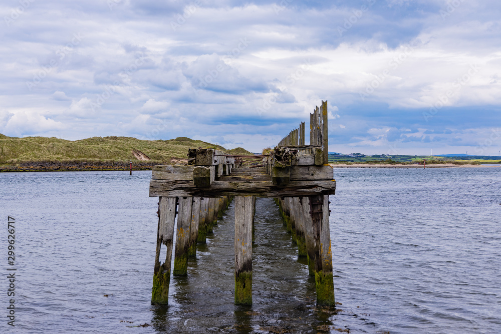Old rotten wooden structure on the river Bann estuary, Castlerock, County Londonderry, Northern Ireland