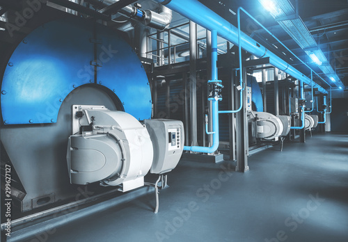Modern industrial gas boiler room equipment for heating system. Heating boilers, pipelines, valves