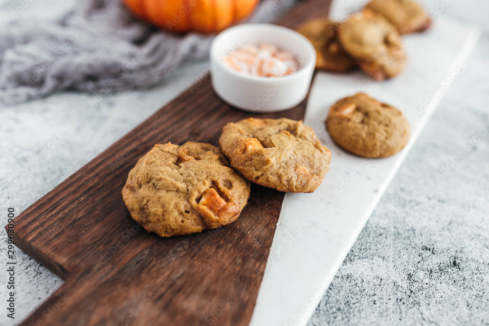 Pumpkin spice truffle cookies on marble and wood serving board Pumpkin spice truffle cookies on marble and wood serving board