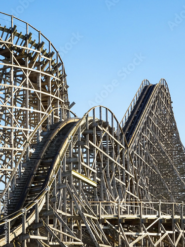 Photography A large wooden roller coaster at an amusement park. thrill