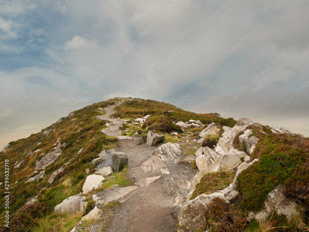 Path on top of Diamond hill, Connemara National park, county Galway Ireland. Cloudy sky, Nobody.