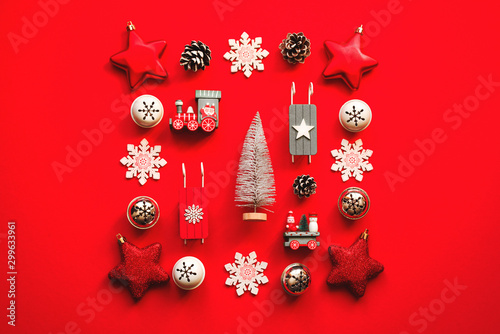 Christmas decorations on a red background, top view, copy space. Festive Christmas bright background