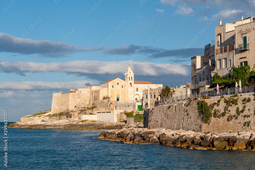 Old town of Vieste, cityscape with medieval church of San Francesco at the tip of the peninsula, Gargano, Apulia, Italy.