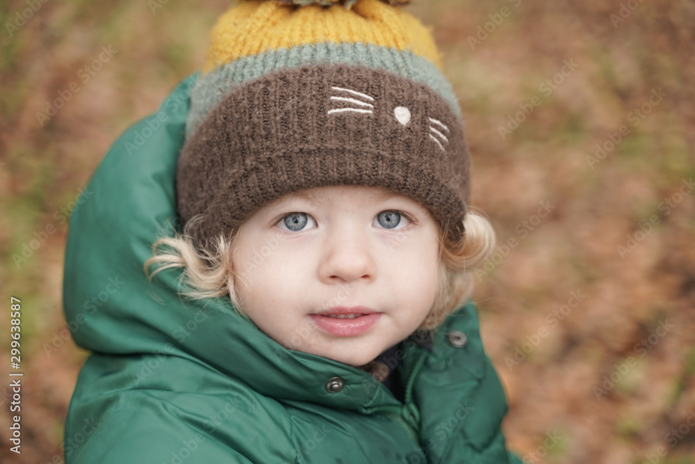 Happy 2 years old child closeup portrait at autumn park