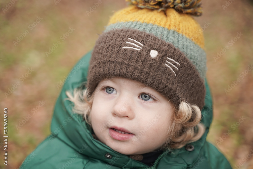 Happy 2 years old child closeup portrait at autumn park