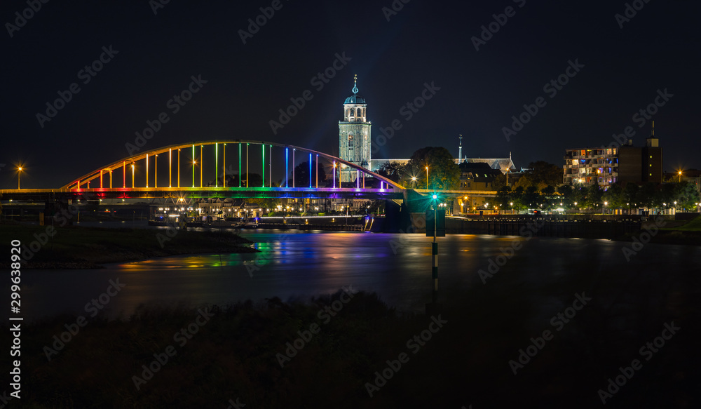 Deventer bridge over river IJssel in rainbow colors on Coming Out Day