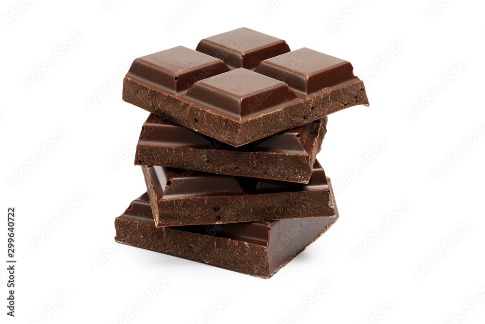 Stack of dark chocolate bar pieces isolated on white background