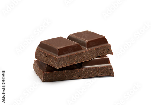 Cubes of dark chocolate bar isolated on white background