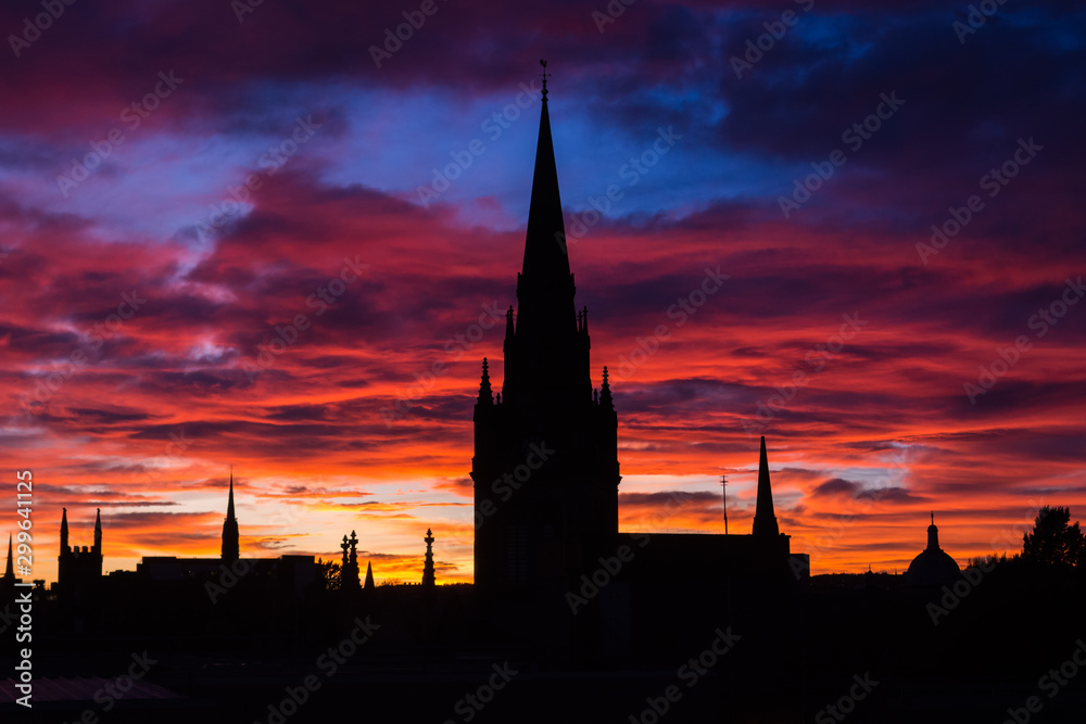 Silhouette of church and buildings in the city center of Aberdeen in Scotland. Amazing and colorful sunset in Aberdeen. Pink and blue sky. Low light photography.