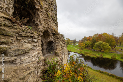 A dilapidated Gremyachaya tower on Gremyachaya hill in Pskov on the Bank of the Pskova river photo