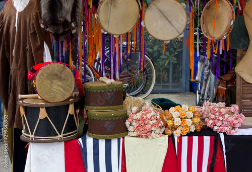 Drums, flowers and other items on a stand
