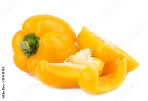 Whole and cut yellow bell peppers isolated on white